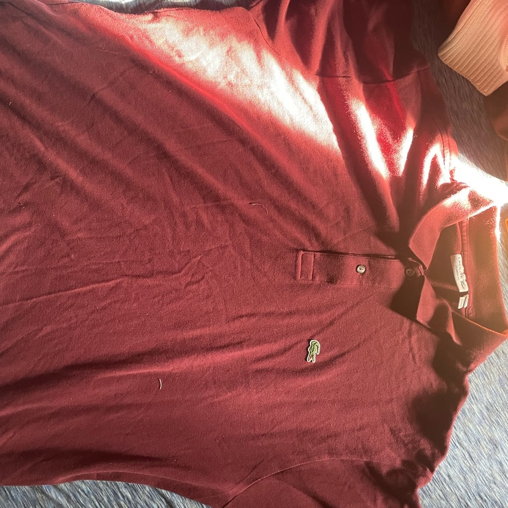 Lacoste Polo in burgundy red. Sizing: US 4XL FR 9